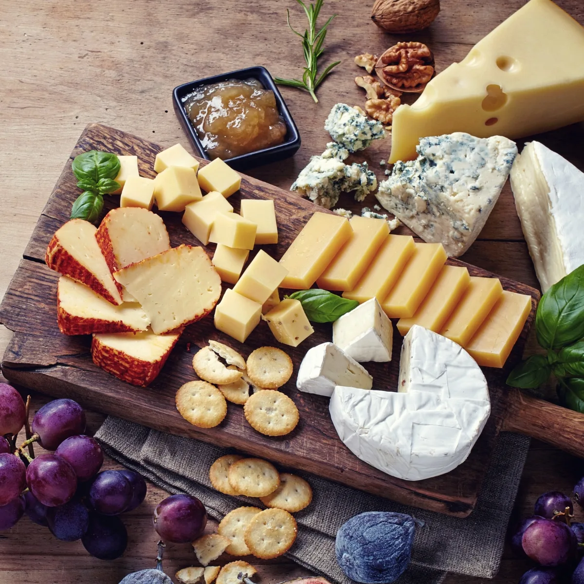 June 4 is National Cheese Day - cheese board with mixed cheeses and fruits