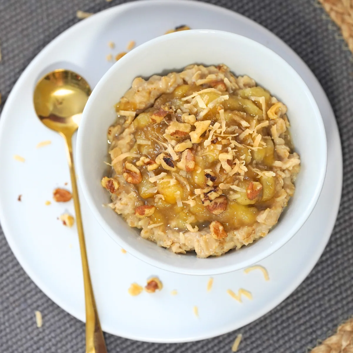 banana's foster oatmeal in a white bowl