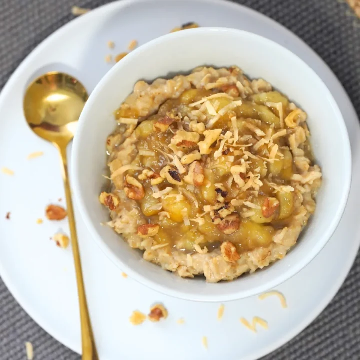 banana's foster oatmeal in a white bowl