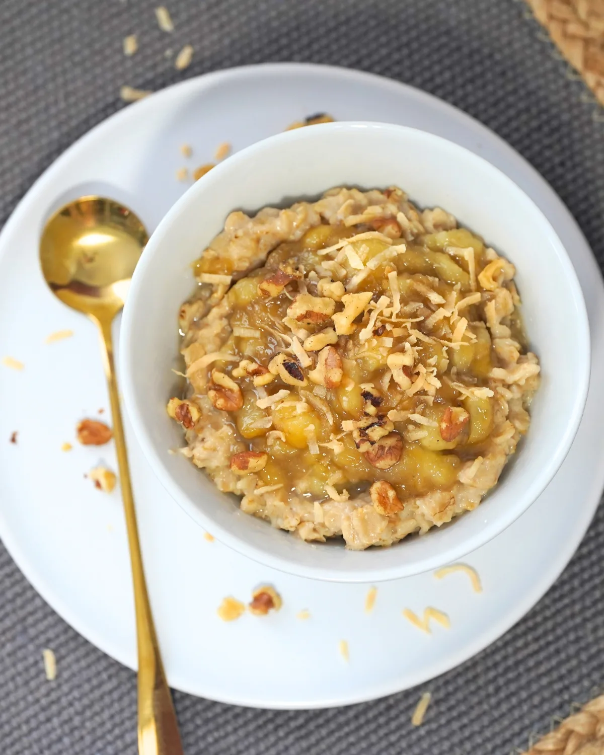 banana's foster oatmeal in a white bowl