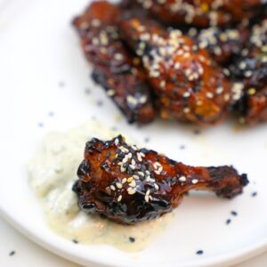 grilled chicken wings with teriyaki sauce on a white plate