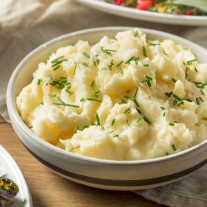 horseradish mashed potatoes in a white bowl on a table