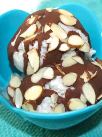 almond joy ice cream - a bowl of ice cream with chocolate and almonds