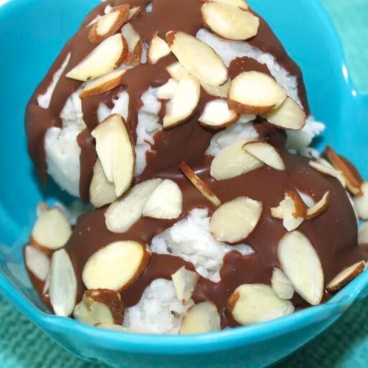 almond joy ice cream - a bowl of ice cream with chocolate and almonds