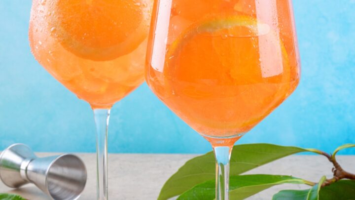 two wine glasses filled with orangecello spritz recipe