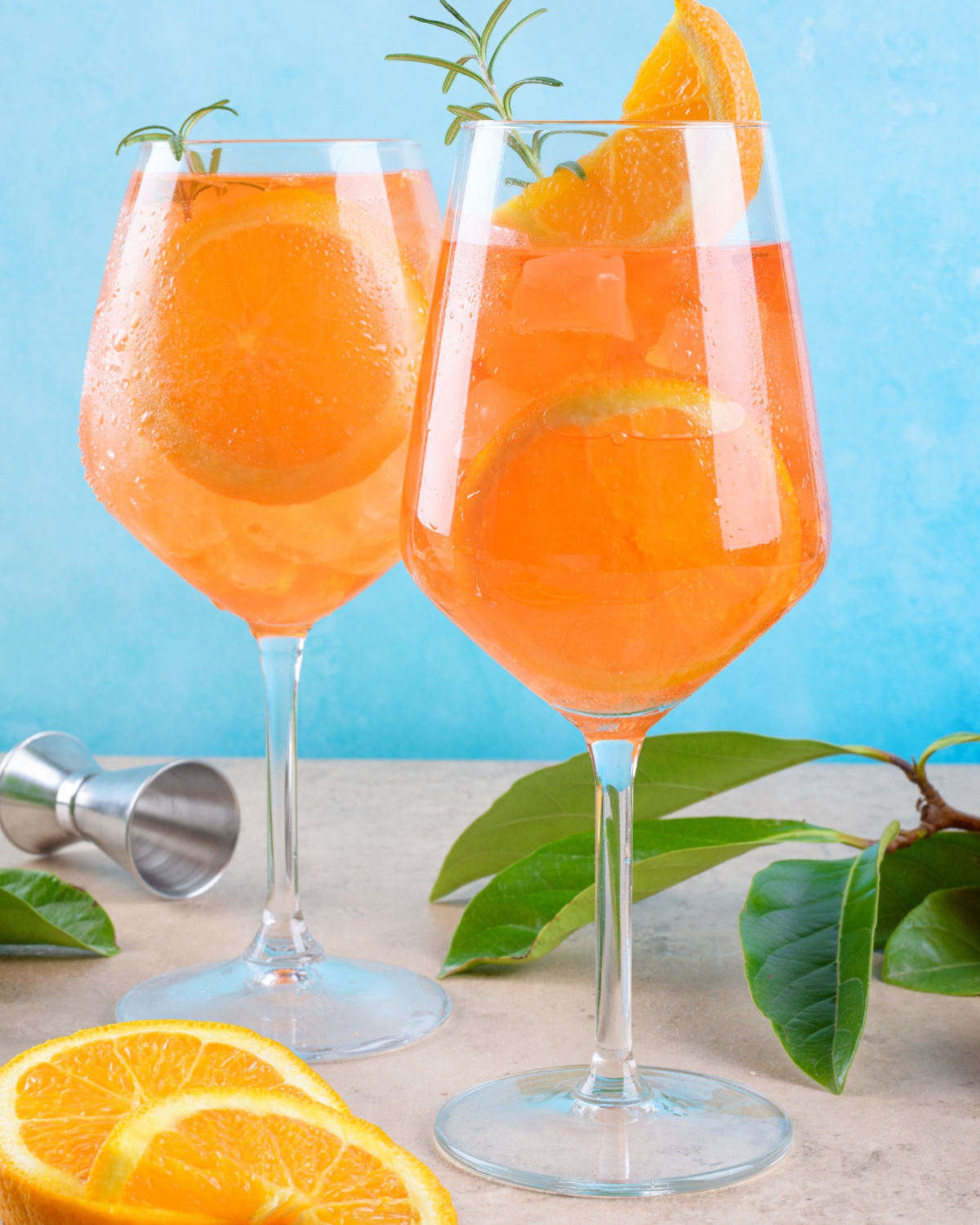 two wine glasses filled with orangecello spritz recipe 