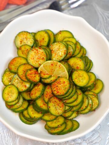 Tajin Cucumber salad in a white bowl