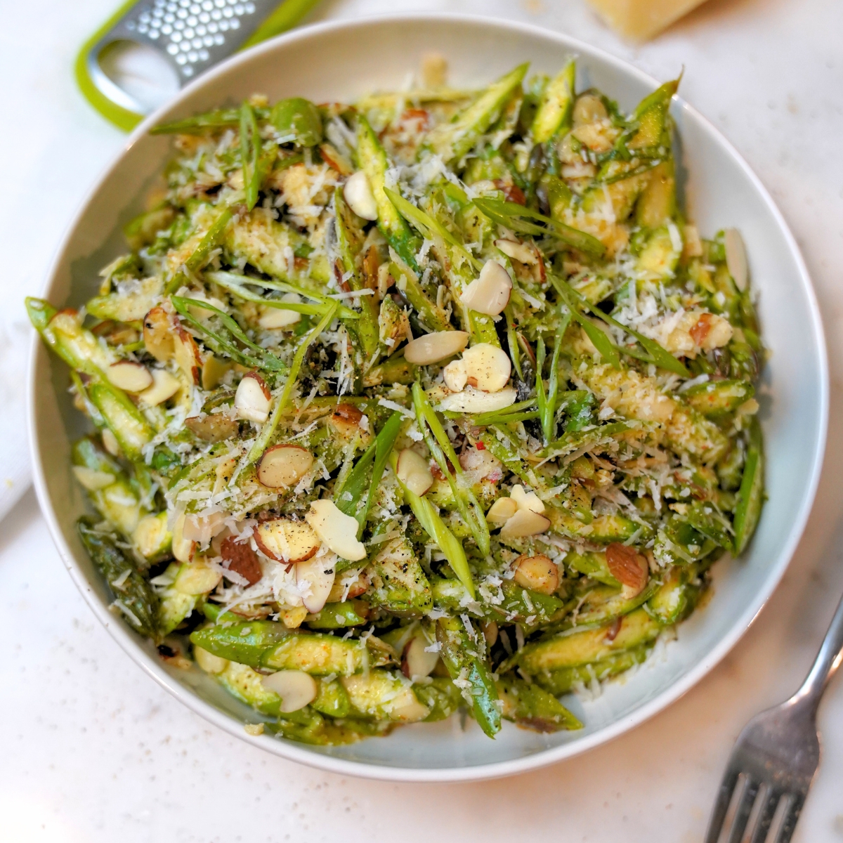 Refreshing Raw Asparagus Salad Recipe in a white bowl