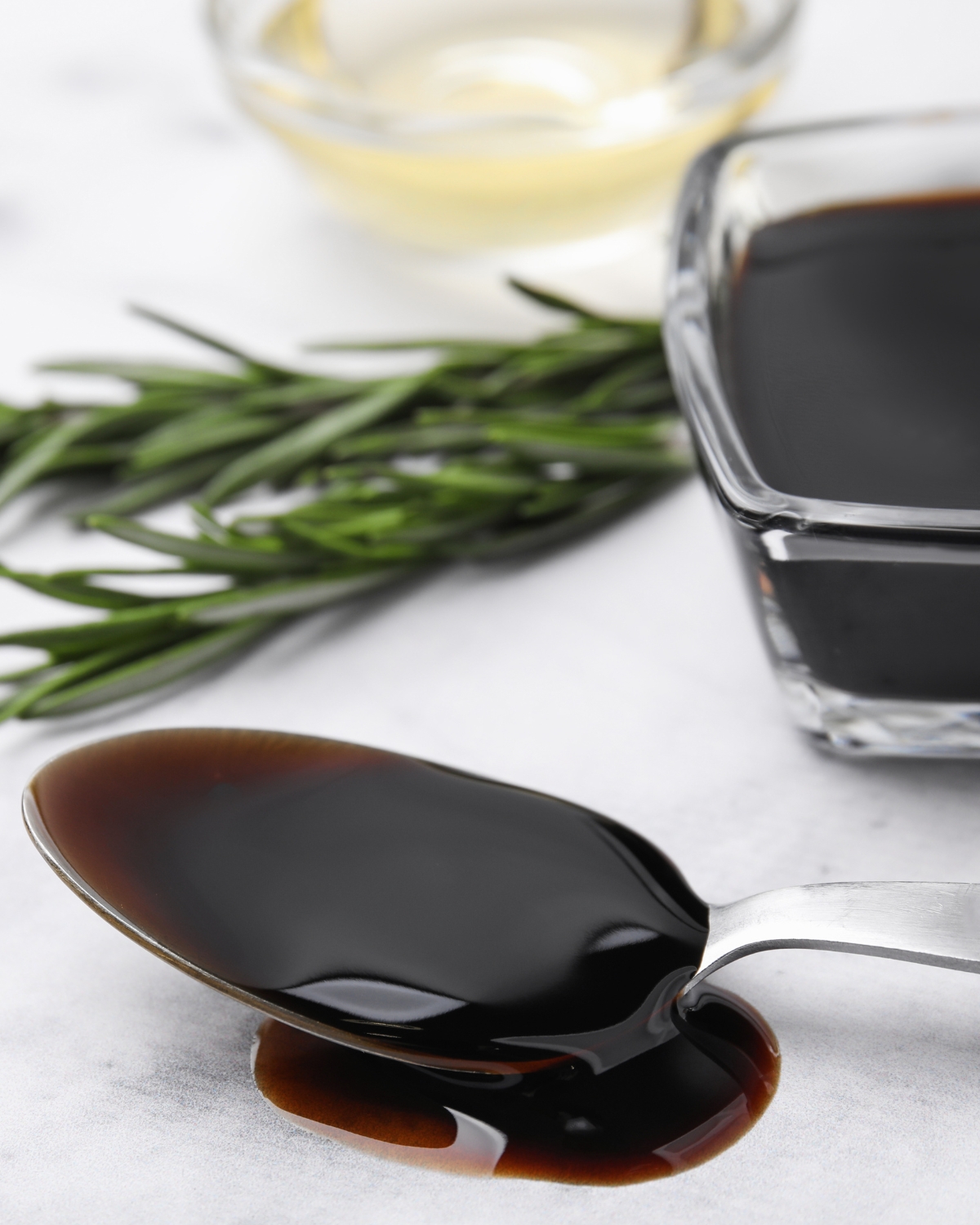 homemade balsamic glaze on a spoon