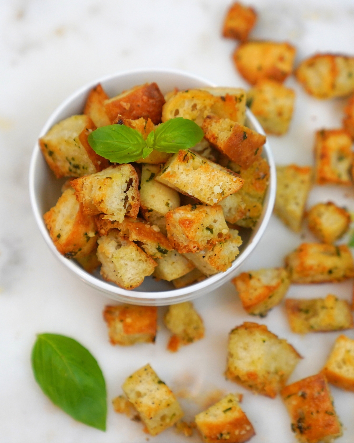 Parmesan Basil Croutons in a white bowl