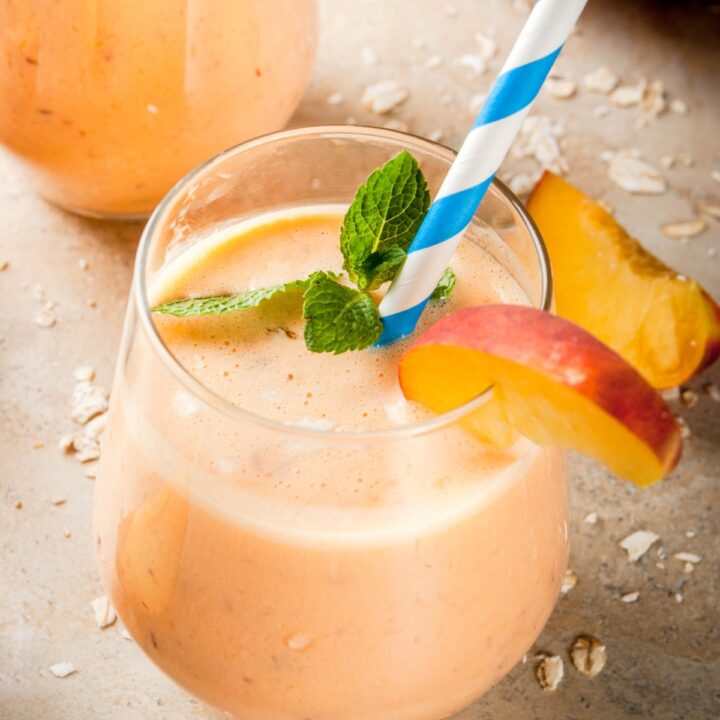 fresh peach smoothie in a glass