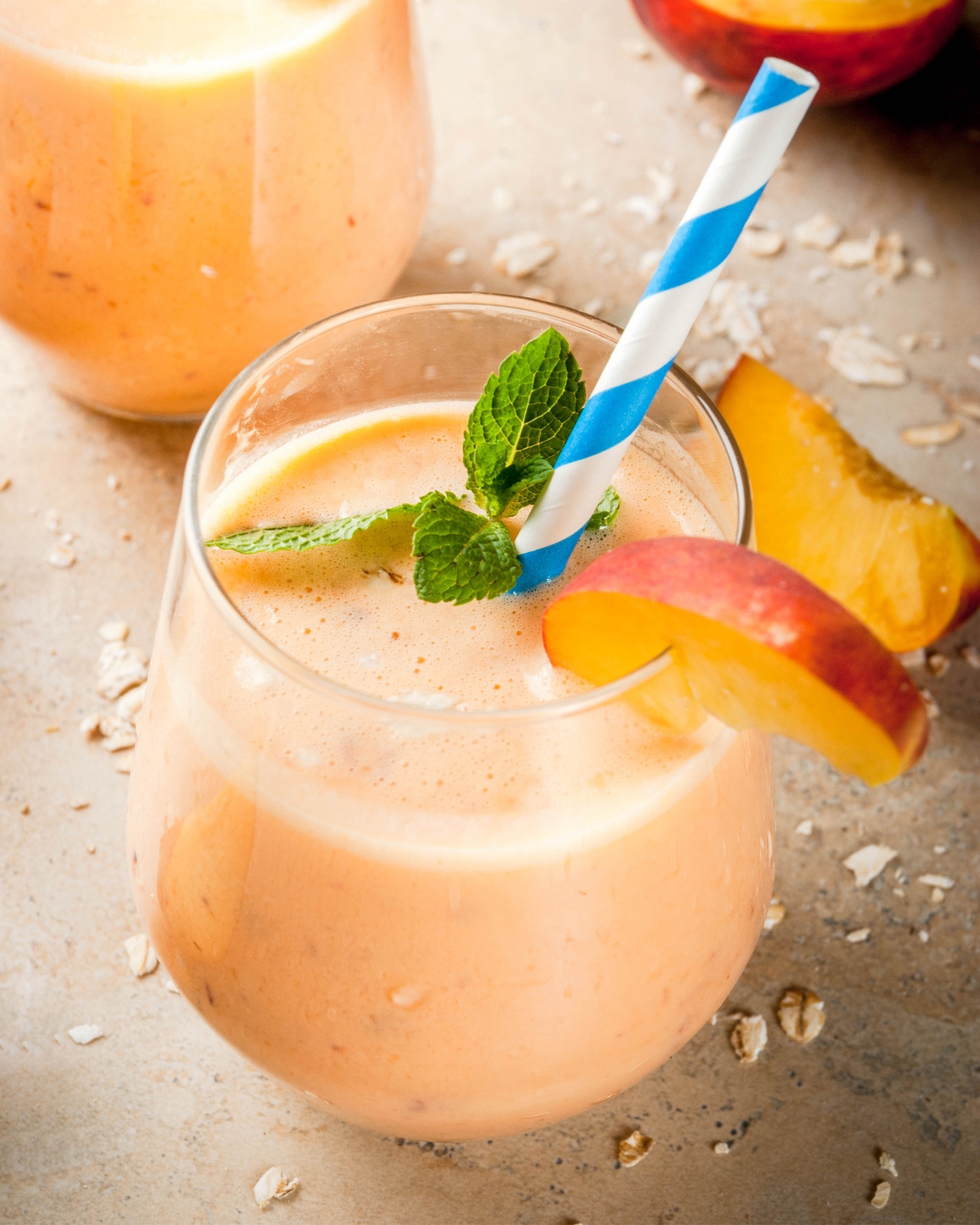 fresh peach smoothie in a glass