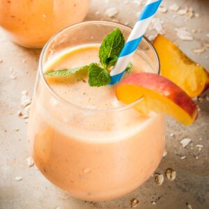 peach smoothie is a glass