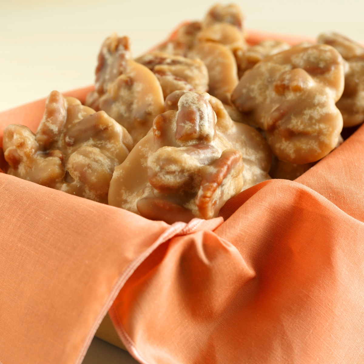 southern pecan pralines in an orange box