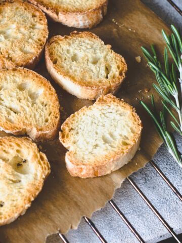 plain crostini on a wooden board