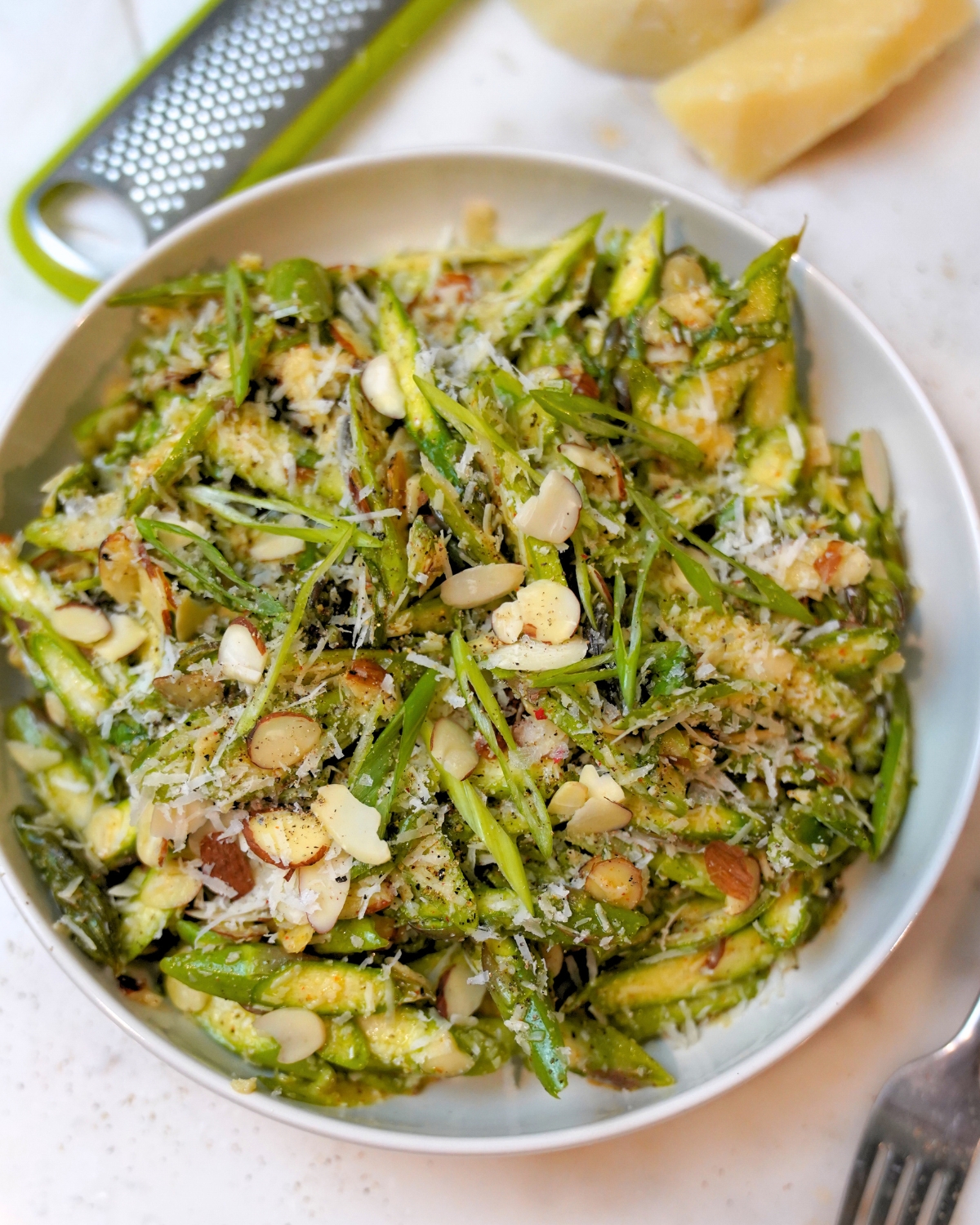 Refreshing Raw Asparagus Salad Recipe in a white bowl