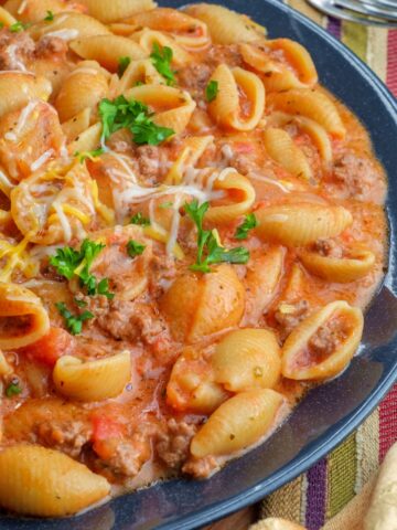 Creamy beef and shells in a blue bowl