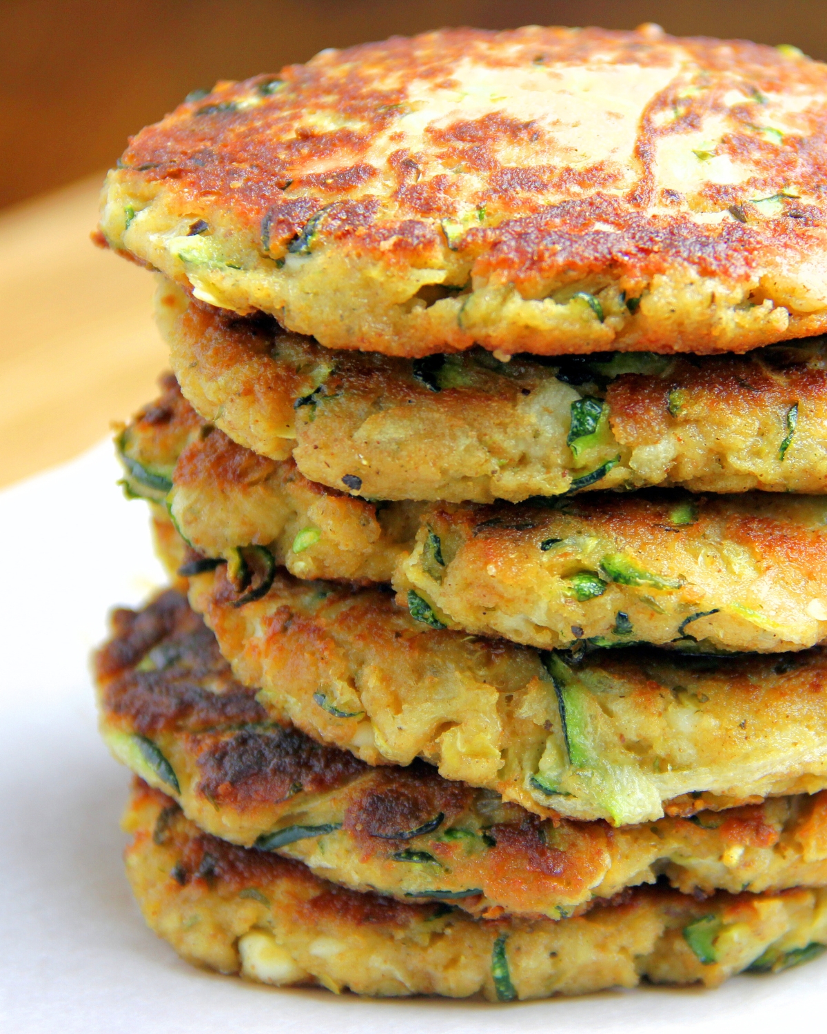 a large stack of Zucchini Fritters