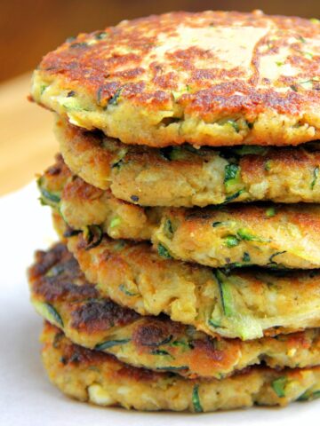 a large stack of Zucchini Fritters