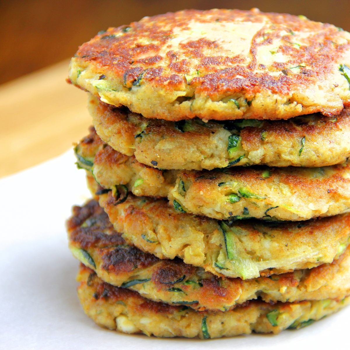 a large stack of Zucchini Fritters