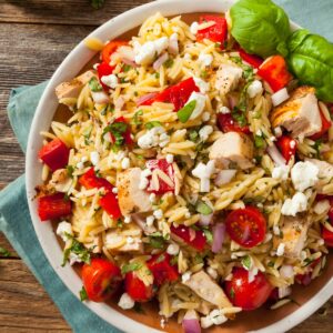 Chicken orzo salad in a white bowl