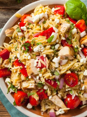 Chicken orzo salad in a white bowl