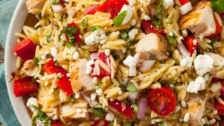 Chicken orzo salad in a white bowl