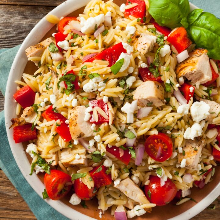 Chicken orzo salad in a white bowl