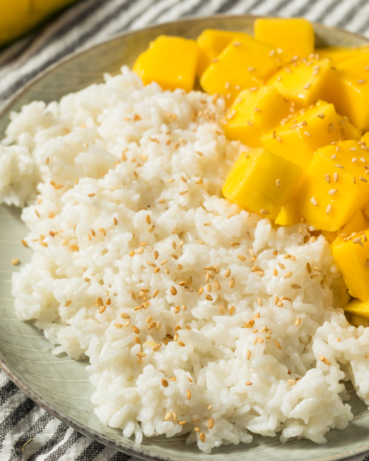 mango sticky rice with coconut and sesame seeds