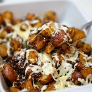 onion soup potatoes in a white baking dish